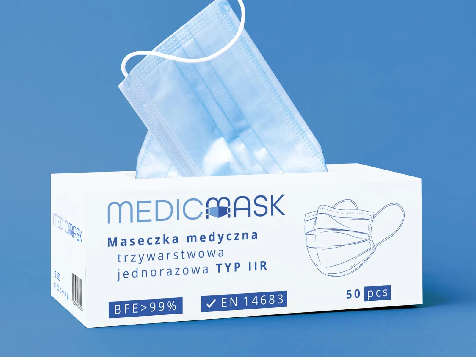 MedicMask - pudełko jednorazowych masek medycznych z wyciągniętą maseczką, na niebieskim tle.