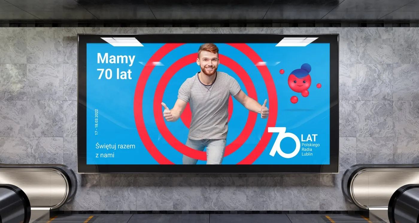 Radio Lublin - billboard „Mamy 70 lat. Świętuj razem z nami" z biegaczem i motywem tarczy na ekranie w przestrzeni miejskiej.